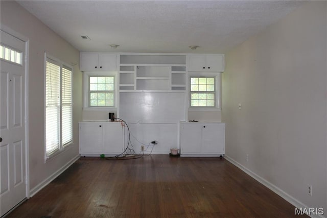 111 W Broadway St, Hayti, MO 63851 - laundry area featuring dark wood-style flooring