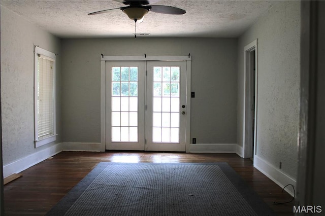111 W Broadway St, Hayti, MO 63851 - doorway with a textured ceiling, a textured wall, ceiling fan, and wood finished floors