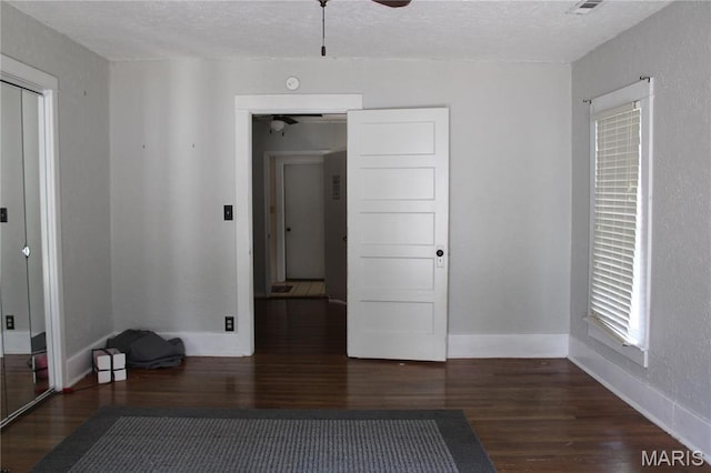 111 W Broadway St, Hayti, MO 63851 - unfurnished room featuring a ceiling fan, wood finished floors, and a textured ceiling