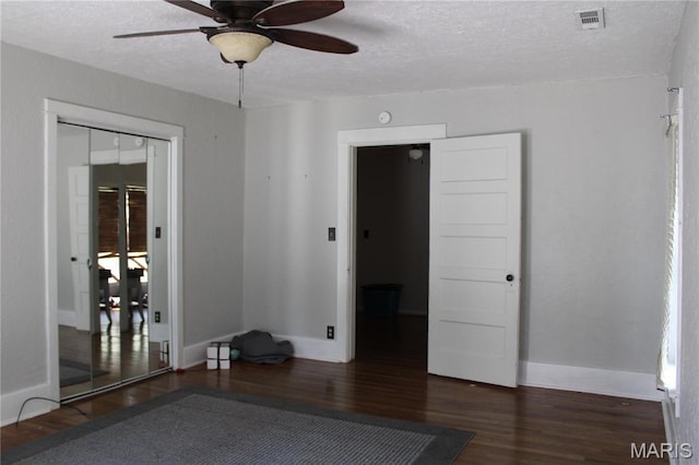 111 W Broadway St, Hayti, MO 63851 - spare room with ceiling fan, a textured ceiling, and wood finished floors