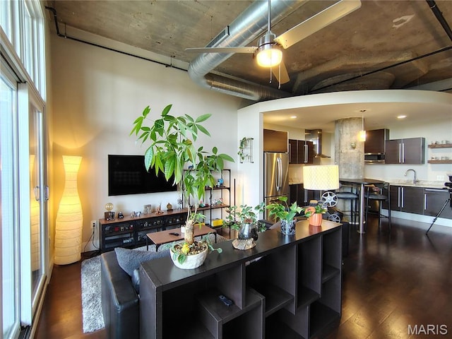 4100 Forest Park Ave Unit 322, Saint Louis, MO 63108 - living room with a ceiling fan and dark wood-type flooring