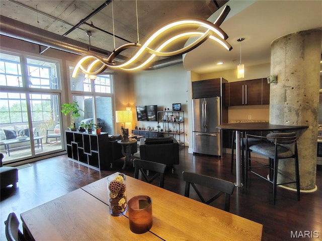 4100 Forest Park Ave Unit 322, Saint Louis, MO 63108 - dining space with dark wood-type flooring and a chandelier