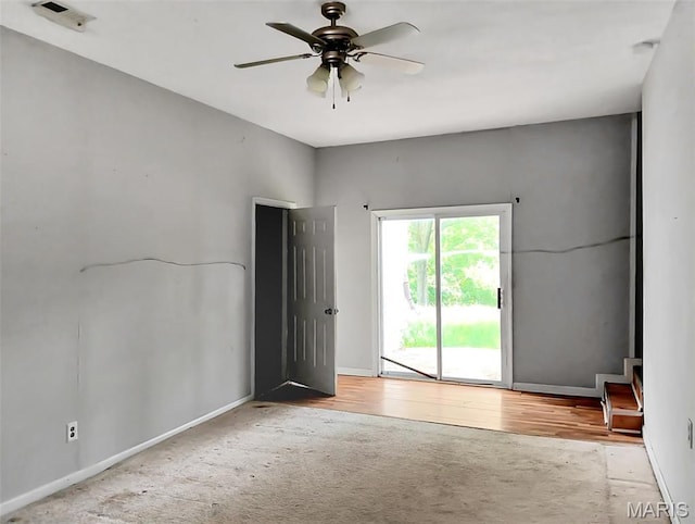 4664 Pogue Dr, House Springs, MO 63051 - empty room featuring ceiling fan, carpet, and wood finished floors