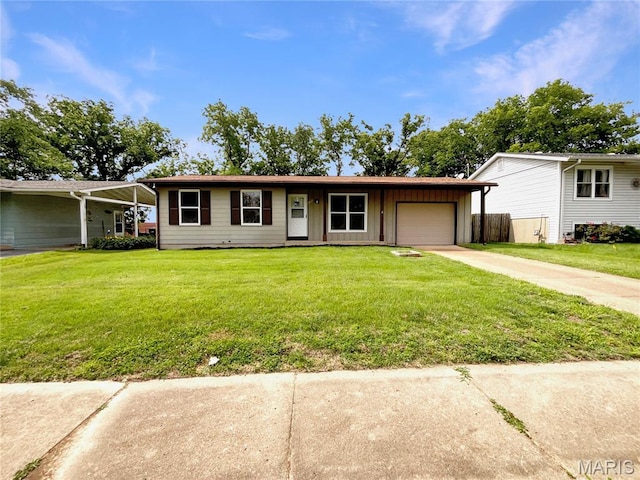 5031 Tulip Tree Ln, Hazelwood, MO 63042 - ranch-style home featuring driveway, an attached garage, board and batten siding, and a front yard