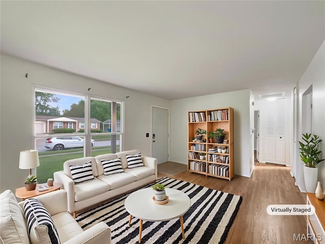 5031 Tulip Tree Ln, Hazelwood, MO 63042 - living area with wood finished floors
