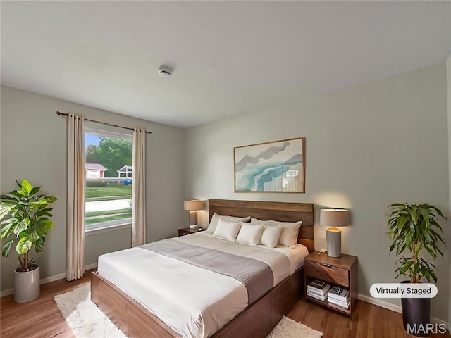 5031 Tulip Tree Ln, Hazelwood, MO 63042 - bedroom featuring wood finished floors