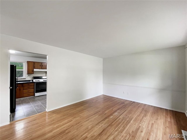 5031 Tulip Tree Ln, Hazelwood, MO 63042 - unfurnished living room with light wood-style floors
