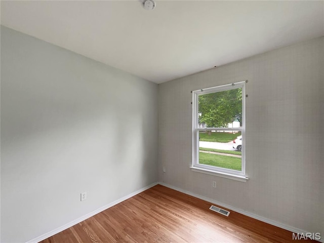 5031 Tulip Tree Ln, Hazelwood, MO 63042 - unfurnished room featuring wood finished floors and a smoke detector