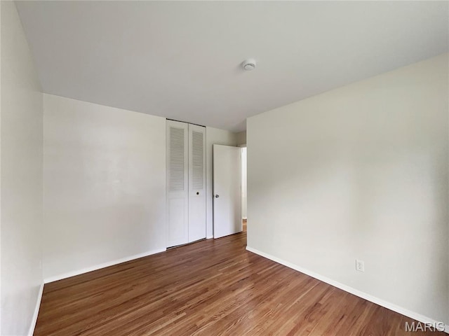5031 Tulip Tree Ln, Hazelwood, MO 63042 - empty room featuring wood finished floors and a smoke detector