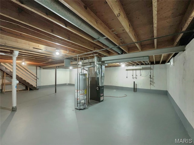 5031 Tulip Tree Ln, Hazelwood, MO 63042 - basement with water heater, stairway, and heating unit