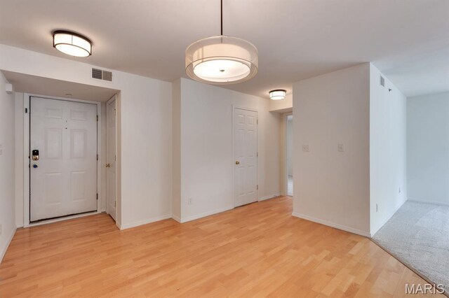 1125 Arbor Creek Dr Unit 2D, Saint Louis, MO 63122 - spare room featuring light wood-style floors and baseboards