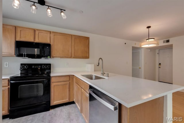 1125 Arbor Creek Dr Unit 2D, Saint Louis, MO 63122 - kitchen with black appliances, a peninsula, light brown cabinetry, light countertops, and hanging light fixtures