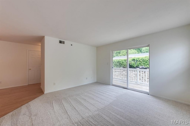 1125 Arbor Creek Dr Unit 2D, Saint Louis, MO 63122 - unfurnished room featuring light carpet and baseboards