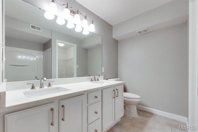 1125 Arbor Creek Dr Unit 2D, Saint Louis, MO 63122 - full bathroom featuring double vanity, a walk in closet, and tile patterned flooring