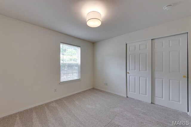 1125 Arbor Creek Dr Unit 2D, Saint Louis, MO 63122 - unfurnished bedroom with carpet floors and a closet