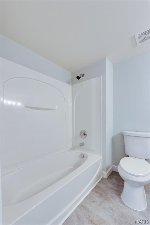 1125 Arbor Creek Dr Unit 2D, Saint Louis, MO 63122 - bathroom featuring shower / bathtub combination and toilet