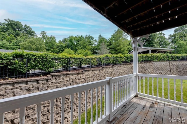 1125 Arbor Creek Dr Unit 2D, Saint Louis, MO 63122 - deck featuring a fenced backyard and view of wooded area