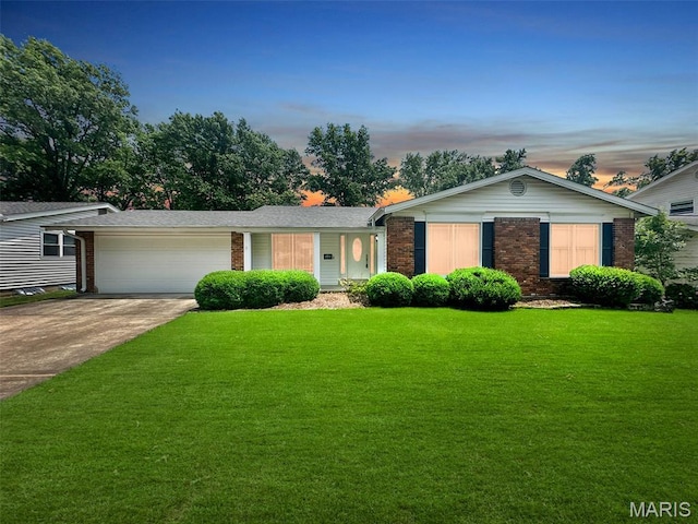 15468 Hitchcock Rd, Chesterfield, MO 63017 - single story home with brick siding, a garage, concrete driveway, and a front yard