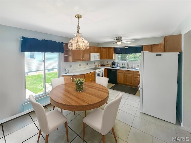 15468 Hitchcock Rd, Chesterfield, MO 63017 - dining area with ceiling fan and light tile patterned flooring