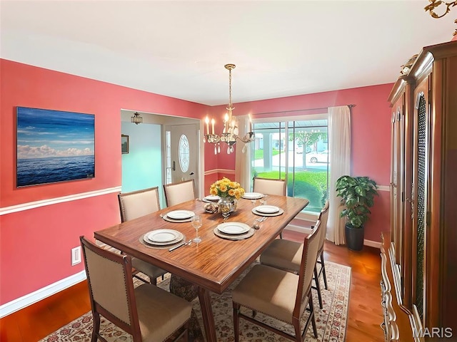 15468 Hitchcock Rd, Chesterfield, MO 63017 - dining room with a chandelier and light wood-type flooring