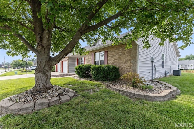 3779 Michael John Dr, Swansea, IL 62226 - view of property exterior featuring a yard, a garage, and brick siding