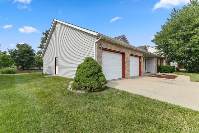 3779 Michael John Dr, Swansea, IL 62226 - view of side of home with a garage, a yard, driveway, and brick siding