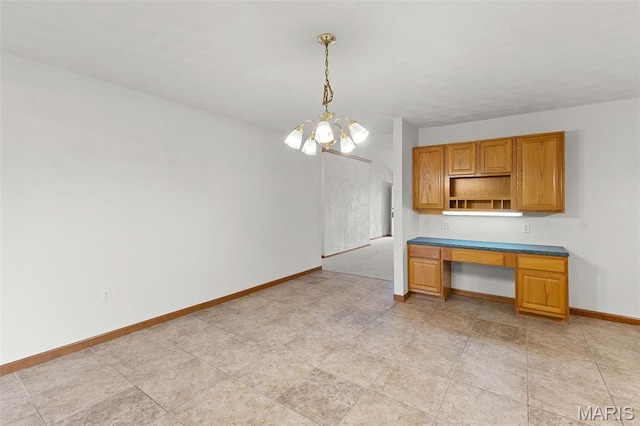 3779 Michael John Dr, Swansea, IL 62226 - kitchen featuring open shelves, built in study area, a chandelier, decorative light fixtures, and dark countertops