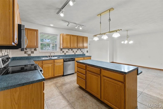 3779 Michael John Dr, Swansea, IL 62226 - kitchen featuring stainless steel appliances, dark countertops, light tile patterned floors, and tasteful backsplash