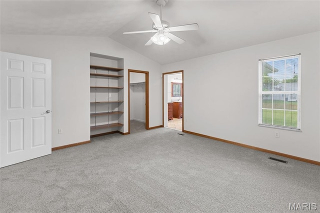 3779 Michael John Dr, Swansea, IL 62226 - unfurnished bedroom featuring carpet, vaulted ceiling, a spacious closet, ensuite bath, and a ceiling fan