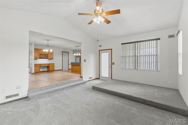 3779 Michael John Dr, Swansea, IL 62226 - unfurnished living room with a chandelier, vaulted ceiling, light colored carpet, and a ceiling fan