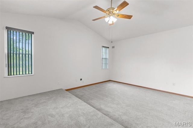 3779 Michael John Dr, Swansea, IL 62226 - empty room with carpet flooring, healthy amount of natural light, lofted ceiling, and a ceiling fan