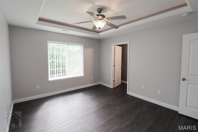 278 Settlers Pass, Waynesville, MO 65583 - empty room featuring a raised ceiling, a ceiling fan, a smoke detector, and dark wood-style flooring