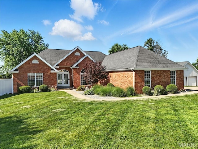 1408 Elm Tree Rd, Troy, MO 63379 - view of front of house with french doors, brick siding, and roof with shingles