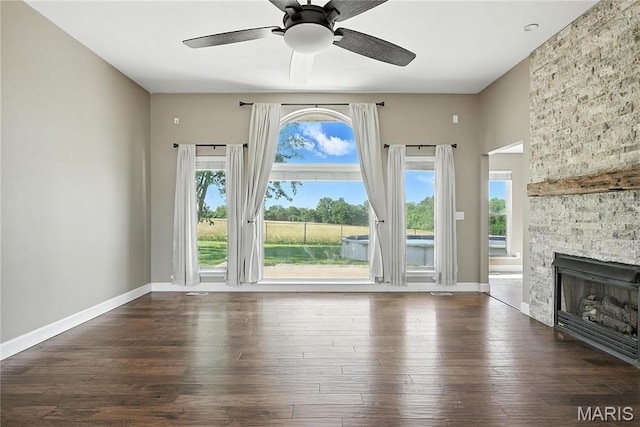 1408 Elm Tree Rd, Troy, MO 63379 - unfurnished living room with plenty of natural light, ceiling fan, hardwood / wood-style flooring, and a stone fireplace