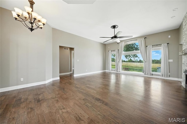 1408 Elm Tree Rd, Troy, MO 63379 - unfurnished living room with a chandelier, a ceiling fan, wood finished floors, a stone fireplace, and vaulted ceiling