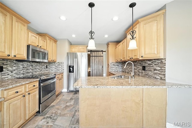1408 Elm Tree Rd, Troy, MO 63379 - kitchen featuring appliances with stainless steel finishes, light brown cabinetry, a peninsula, light stone finish flooring, and light stone countertops