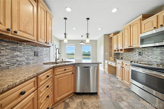 1408 Elm Tree Rd, Troy, MO 63379 - kitchen featuring stainless steel appliances, tasteful backsplash, stone tile floors, a peninsula, and light stone countertops
