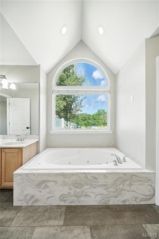 1408 Elm Tree Rd, Troy, MO 63379 - full bathroom with vaulted ceiling, vanity, a jetted tub, and recessed lighting