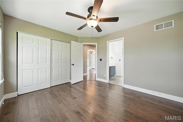 1408 Elm Tree Rd, Troy, MO 63379 - unfurnished bedroom with a chandelier, a closet, wood finished floors, and a ceiling fan