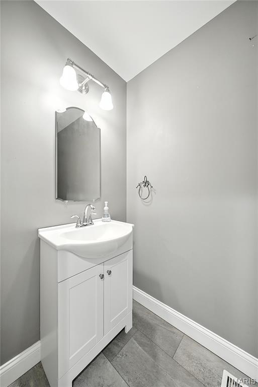1408 Elm Tree Rd, Troy, MO 63379 - bathroom featuring vanity and baseboards
