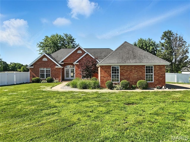 1408 Elm Tree Rd, Troy, MO 63379 - view of front of home featuring french doors, brick siding, and roof with shingles