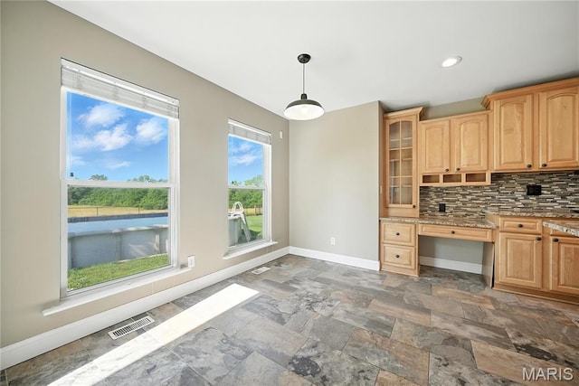 1408 Elm Tree Rd, Troy, MO 63379 - kitchen with stone tile floors, light brown cabinetry, tasteful backsplash, glass insert cabinets, and recessed lighting