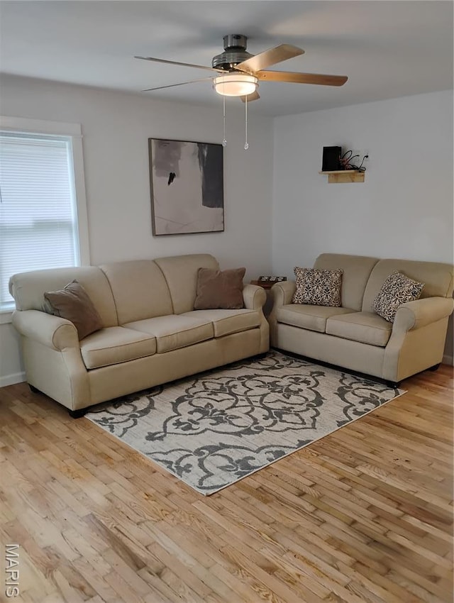 131 Sackett St, Licking, MO 65542 - living area with a ceiling fan and light wood-style floors