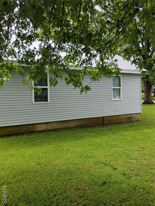 131 Sackett St, Licking, MO 65542 - view of side of home featuring a yard
