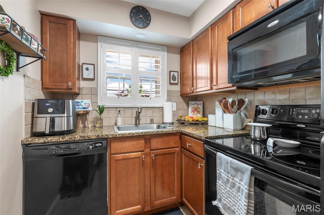 946 Marshall Ave Unit A, Webster Groves, MO 63119 - kitchen with black appliances, brown cabinets, backsplash, and dark stone countertops
