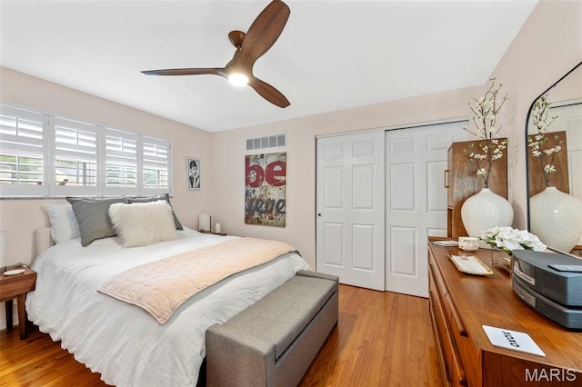 946 Marshall Ave Unit A, Webster Groves, MO 63119 - bedroom with light wood-type flooring, a closet, and a ceiling fan