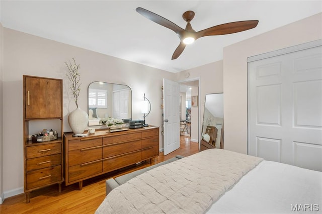 946 Marshall Ave Unit A, Webster Groves, MO 63119 - bedroom with light wood-style floors, ceiling fan, and a closet