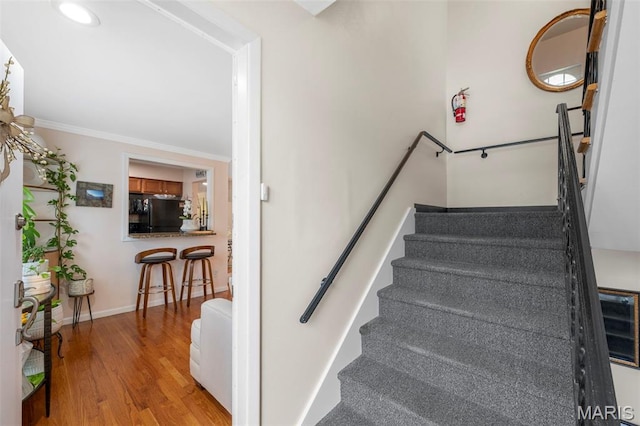 946 Marshall Ave Unit A, Webster Groves, MO 63119 - stairway featuring wood finished floors, crown molding, and recessed lighting