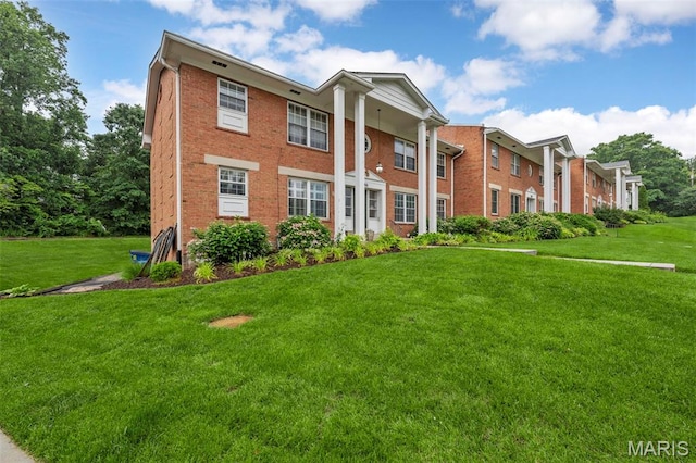 946 Marshall Ave Unit A, Webster Groves, MO 63119 - view of front facade featuring brick siding and a front yard