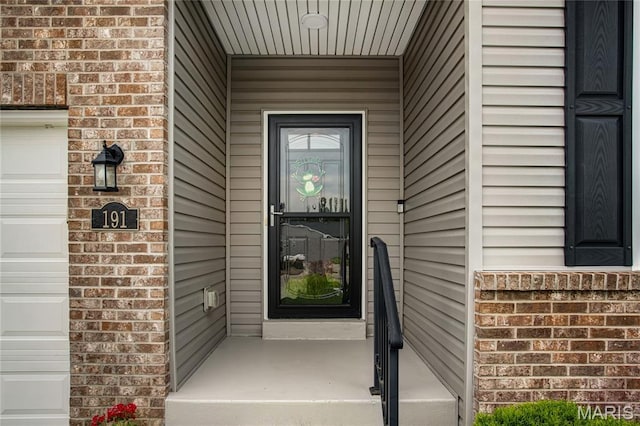 191 Noahs Mill Dr, Lake St Louis, MO 63367 - entrance to property with brick siding and a garage